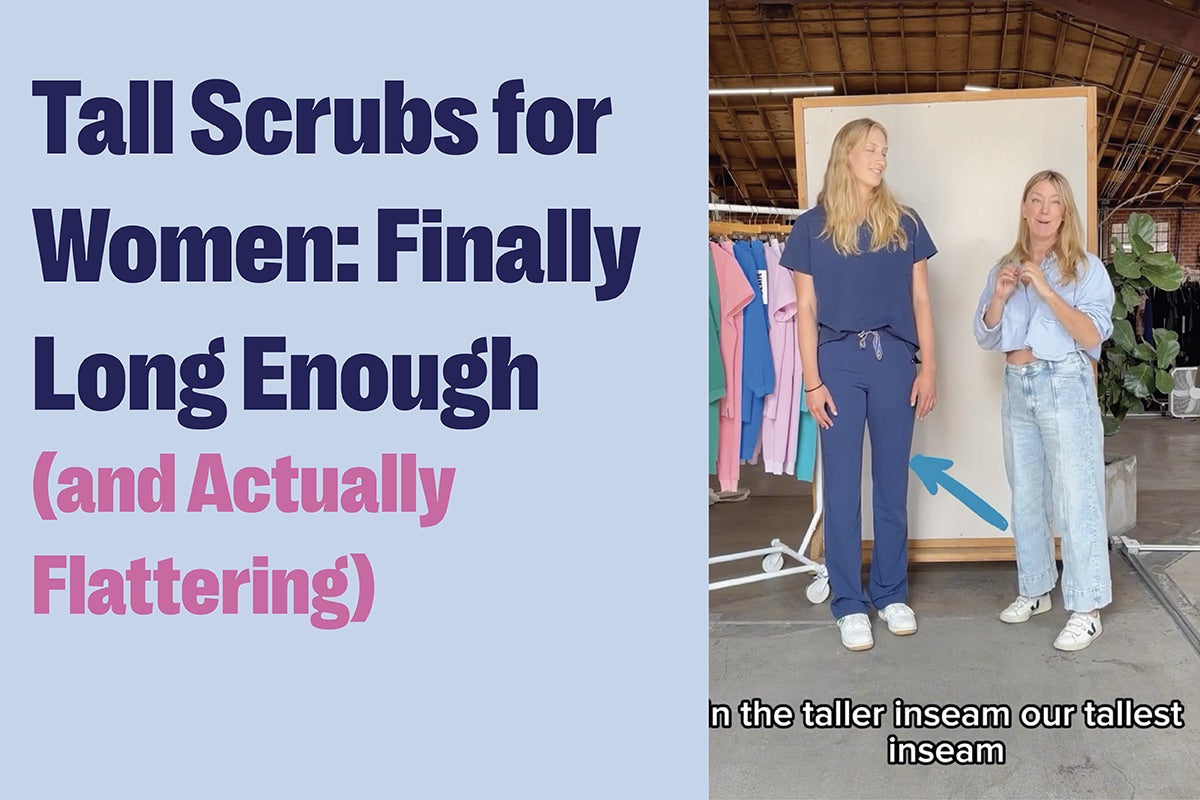 Tall scrubs for women shown on a tall female model wearing navy scrub pants with a full-length inseam that reaches the floor, demonstrating a flattering fit for tall women.