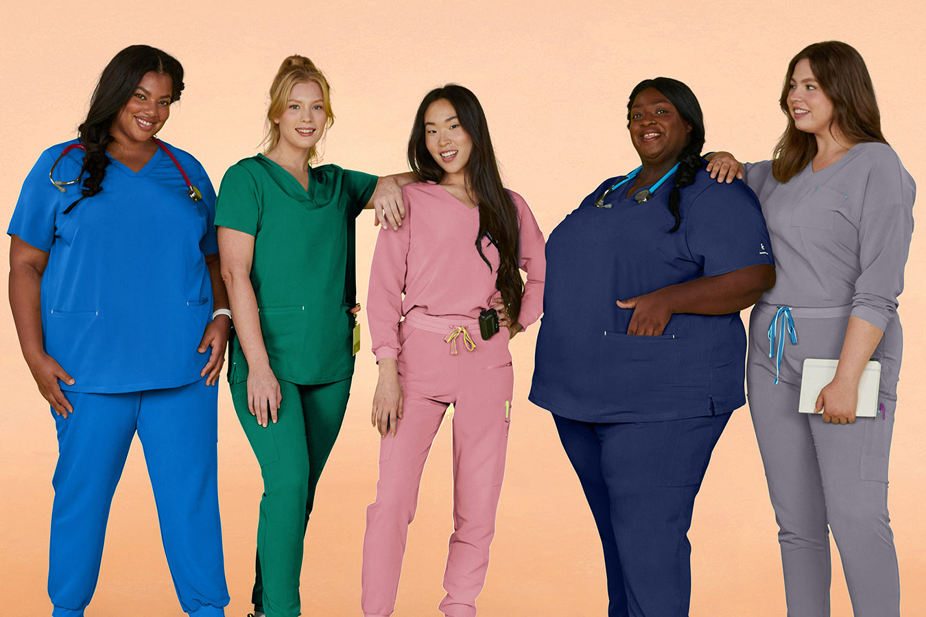 Healthcare professionals standing together in scrubs, showing a range of fits and styles for medical staff