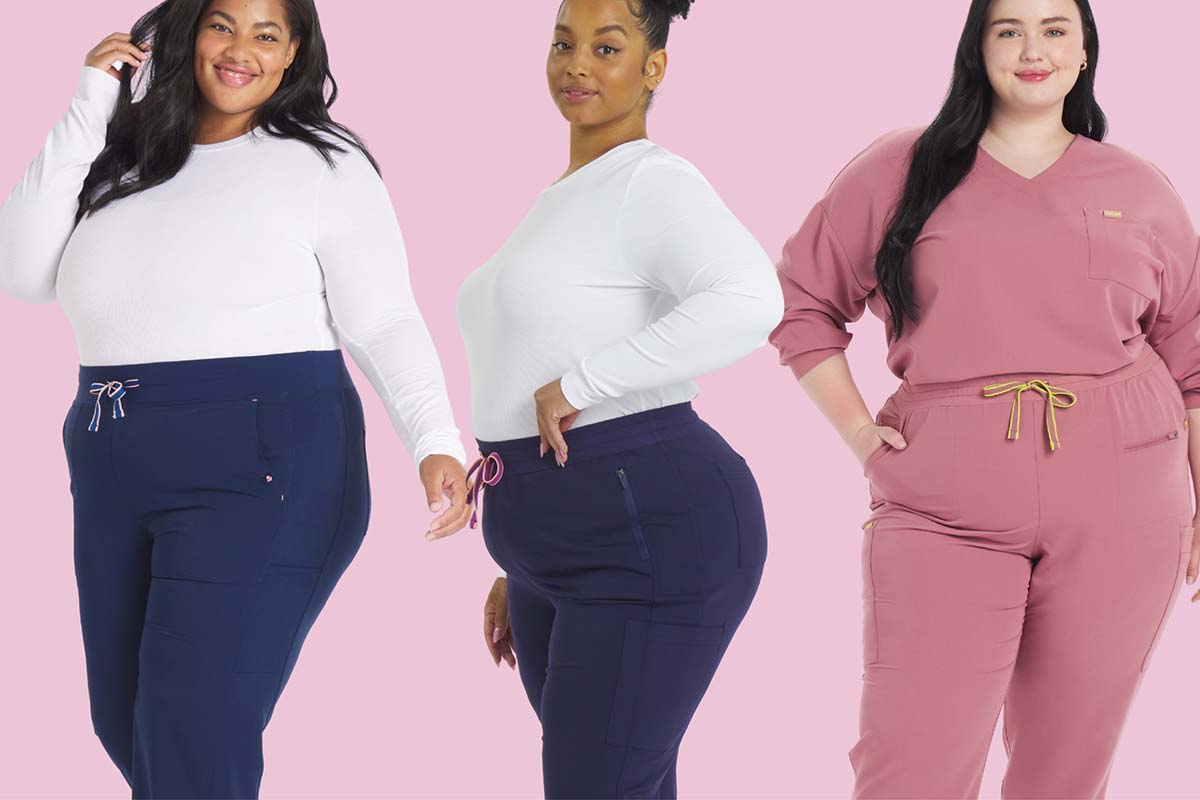Three plus-size women wearing navy and mauve Dolan scrub pants, displaying inclusive sizing and flattering fit for plus-size scrubs.