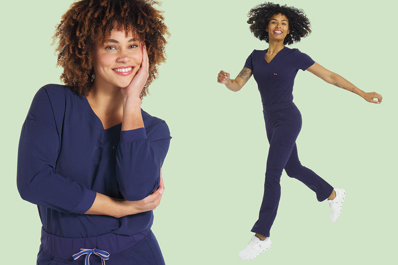 Woman wearing navy scrubs moves comfortably, showcasing soft, flexible, and durable scrubs designed for all-day comfort during long healthcare shifts.