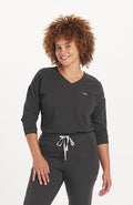 Woman in Alpine Dolman 2-Pocket CORE Scrub Top Charcoal- DOLAN