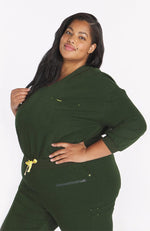 Woman wearing dark olive the Alpine 3/4 sleeve scrub top from DOLAN