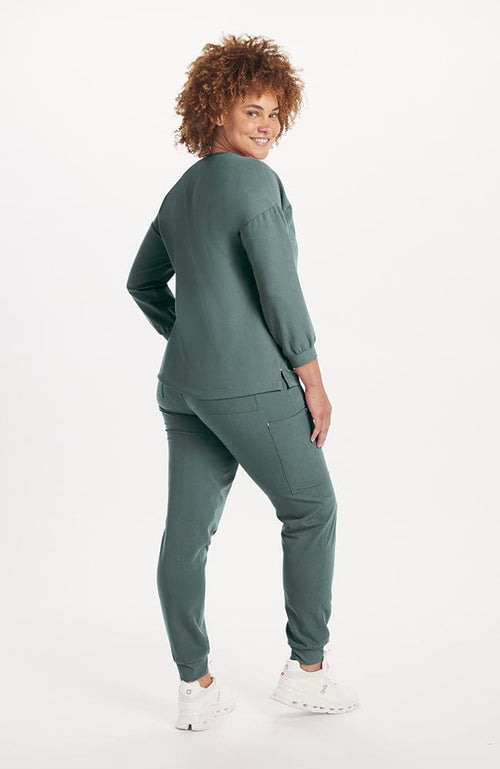 Woman wearing Alpine Top in Deep Sage 