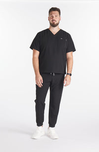 Man wearing Andre 8-Pocket Men's CORE Scrub Jogger Pant-Black-DOLAN