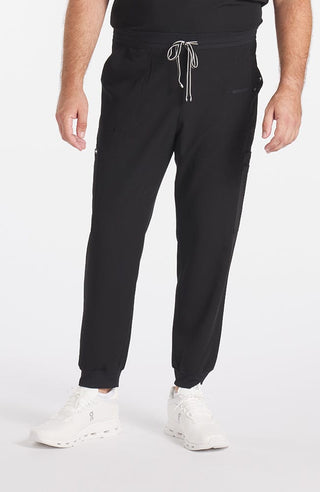 Man wearing Andre 8-Pocket Men's CORE Scrub Jogger Pant-Black-DOLAN