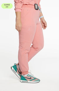 Woman in 11 pocket Hope Jogger pant in Mauve Pink