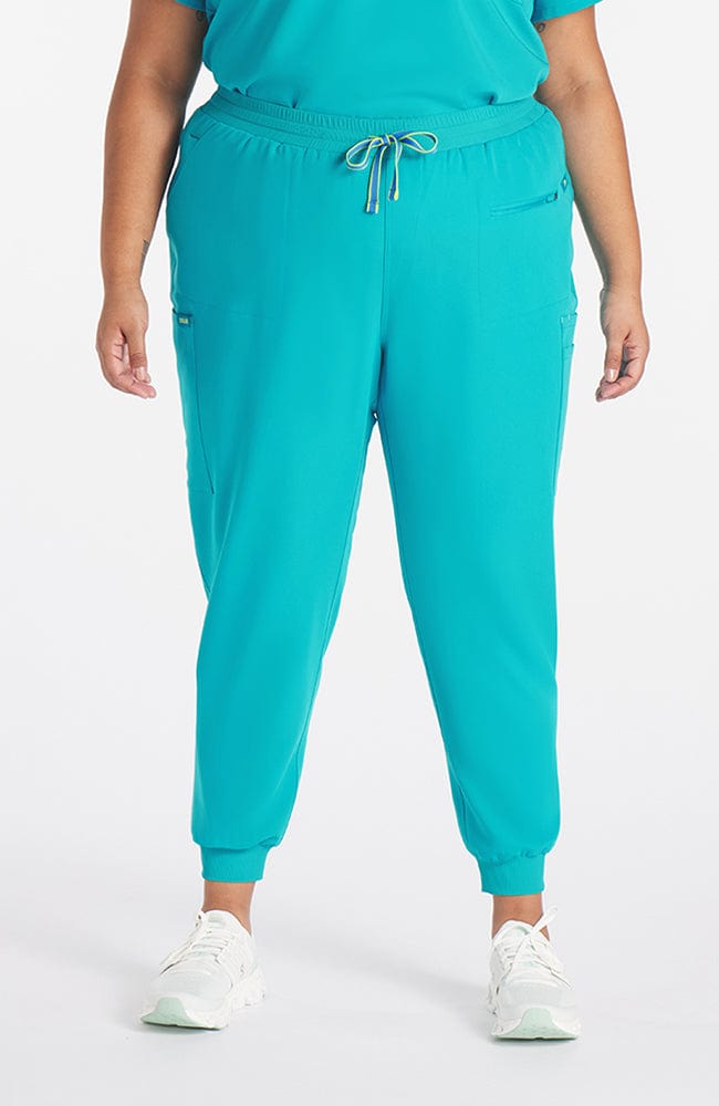 Super comfortable Teal scrub pants with 11 pockets on woman