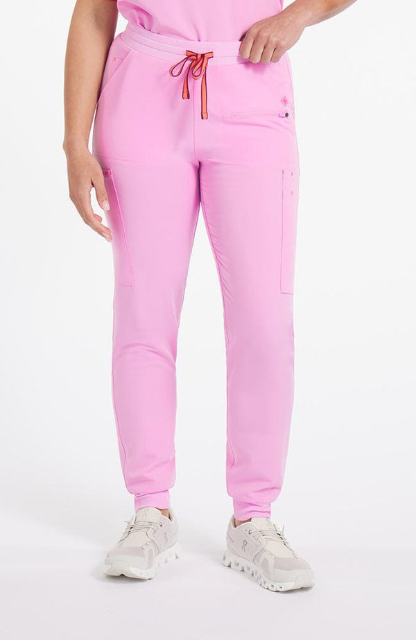 Woman wearing Hope 11-Pocket CORE Scrub Jogger Pant in Brilliant Lilac