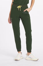 Woman wearing dark olive Hope 11 pocket joggers from DOLAN 