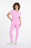 Woman wearing Mayfair V Neck 2-Pocket CORE Scrub Top in Brilliant Lilac