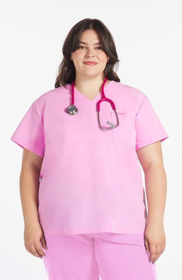 Woman wearing Mayfair V Neck 2-Pocket CORE Scrub Top in Brilliant Lilac