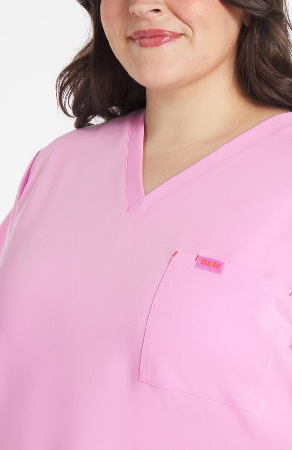 Woman wearing Mayfair V Neck 2-Pocket CORE Scrub Top in Brilliant Lilac