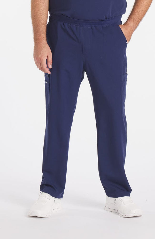 Man wearing Orlando 9-Pocket Men's CORE Scrub Cargo Pant in Navy Blue - DOLAN