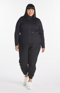 Park slim fit active jacket in black on a dark haired woman