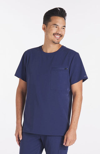 Man wearing Navy Blue Ravi Crew Neck 3-Pocket Men's CORE Scrub Top
