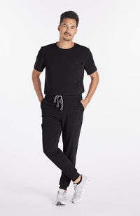 Man wearing Ravi Crew Neck 3-Pocket Men's CORE Scrub Top in Blac