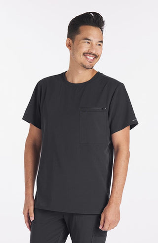 Man wearing Ravi Crew Neck 3-Pocket Men's CORE Scrub Top in Charcoal