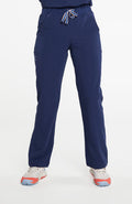 A woman wearing District high-waisted scrub pants 6-pocket CORE scrub in navy.