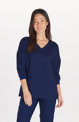 Solaire TLC scrub top in navy blue by DOLAN